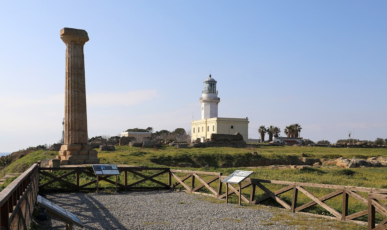 The single Doric column of the temple of Hera Lacinia with the Capo Colonna lighthouse behind it