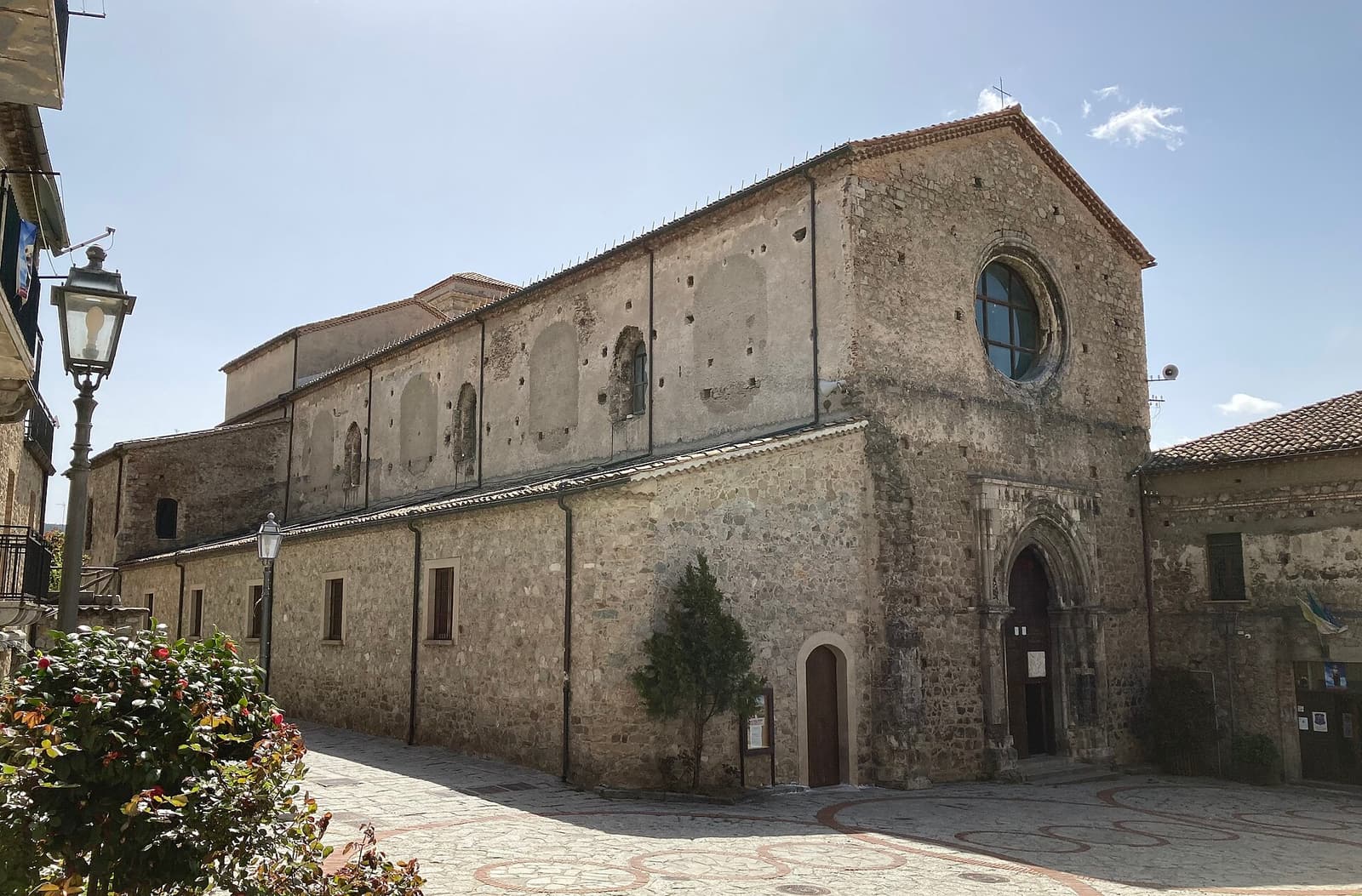 The plain stone facade of the Florense Abbey in San Giovanni in Fiore
