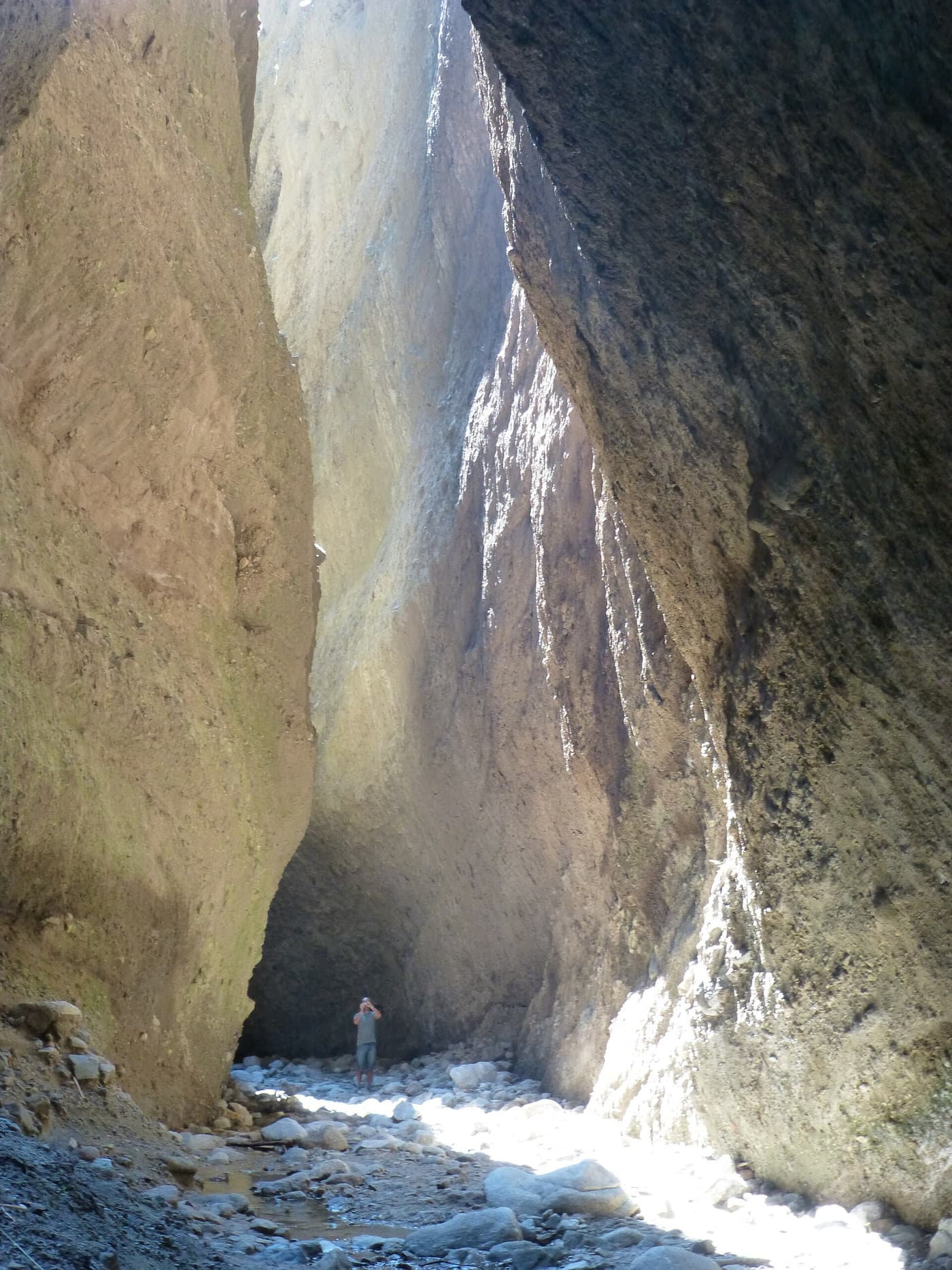 Sheer rock walls closing in on the narrow gorge of the Valli Cupe canyon
