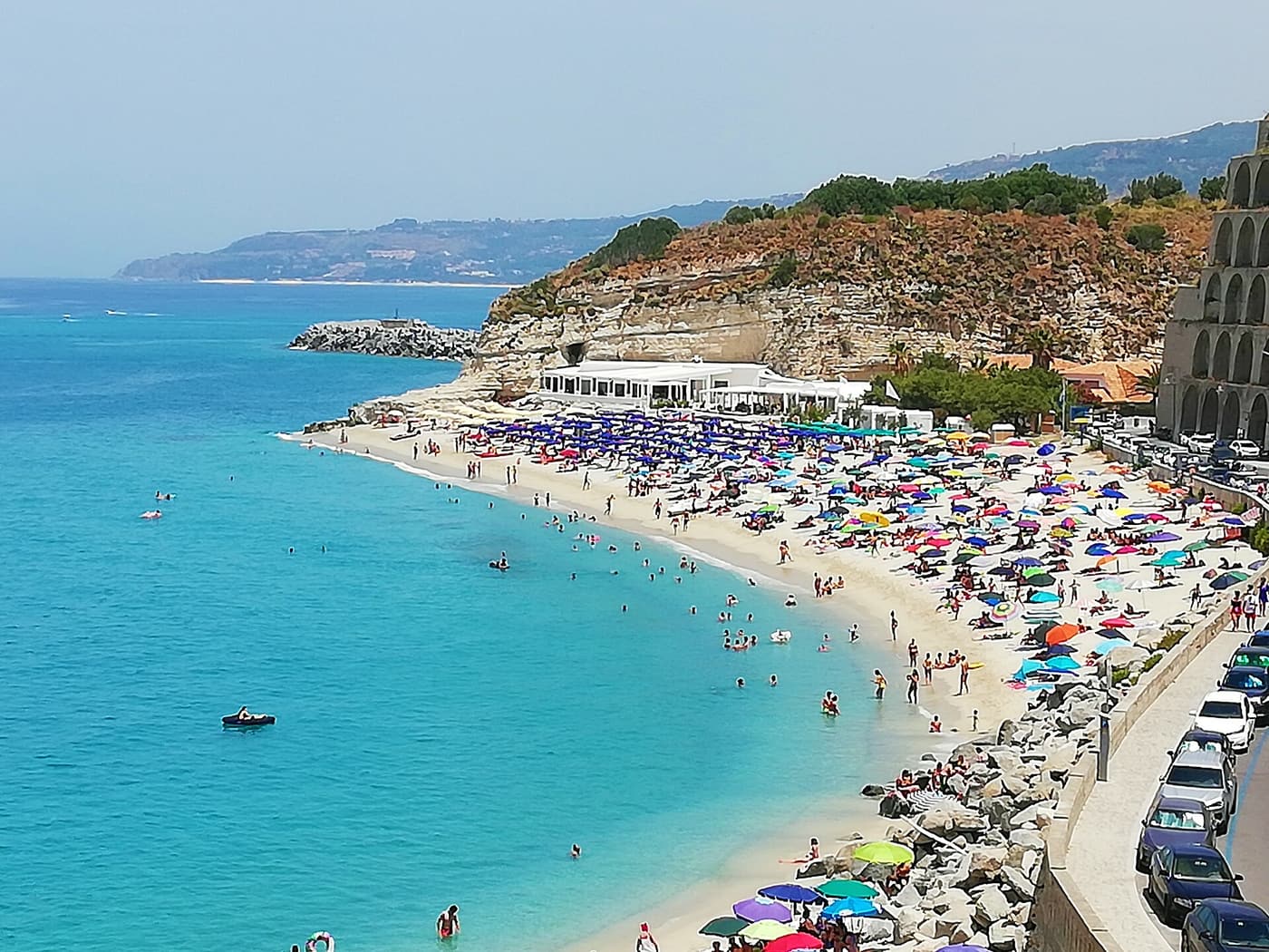 The white beach and turquoise water below the cliffs of Tropea
